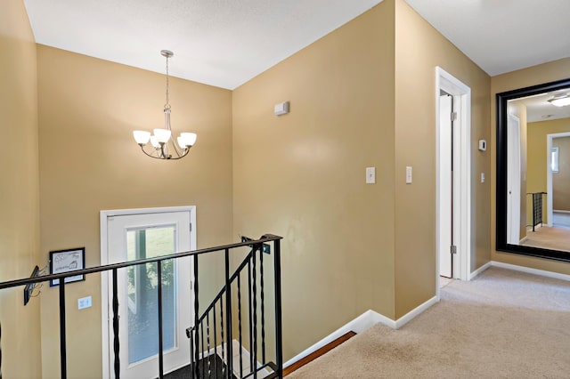 12329 Timber Ln, Maple Grove, MN 55369 - hall featuring an upstairs landing, a chandelier, carpet floors, and baseboards