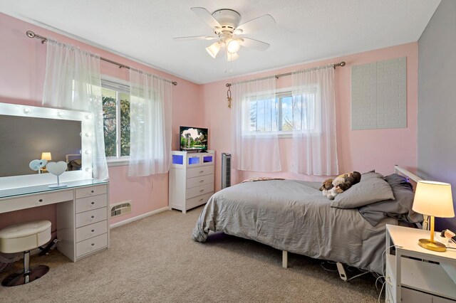 12329 Timber Ln, Maple Grove, MN 55369 - bedroom featuring light carpet, an office area, baseboards, and a ceiling fan