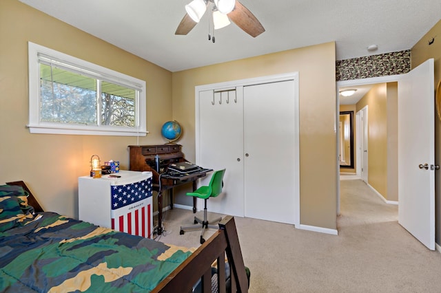 12329 Timber Ln, Maple Grove, MN 55369 - carpeted bedroom featuring baseboards, a closet, and a ceiling fan
