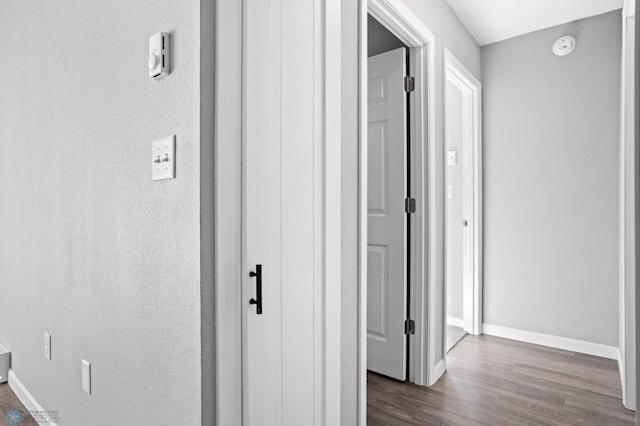 506 5th St E Unit 2, Fargo, ND 58078 - hallway featuring baseboards and dark wood-type flooring