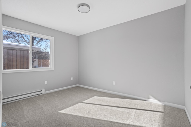 506 5th St E Unit 2, Fargo, ND 58078 - spare room featuring baseboard heating, baseboards, and carpet flooring