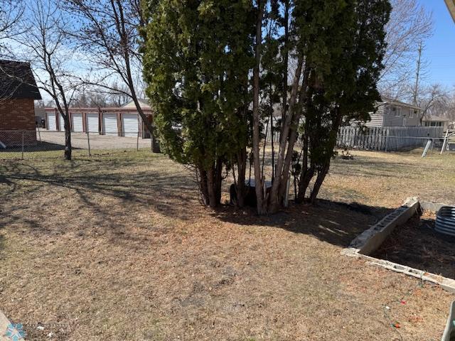 506 5th St E Unit 2, Fargo, ND 58078 - view of yard featuring fence