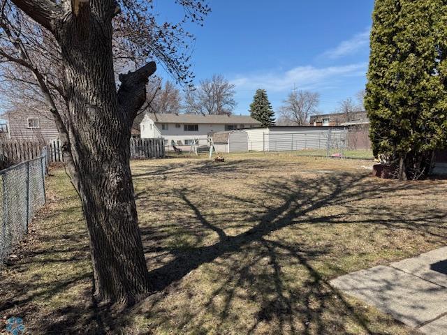 506 5th St E Unit 2, Fargo, ND 58078 - view of yard with fence