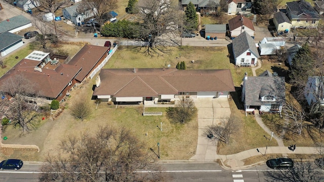 aerial view of property and surrounding area featuring nearby suburban area