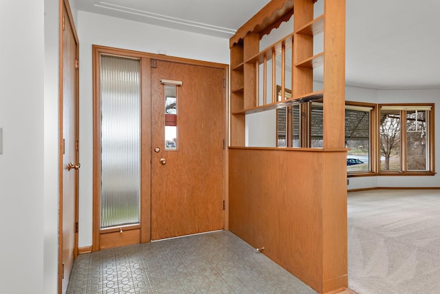 foyer entrance with baseboards