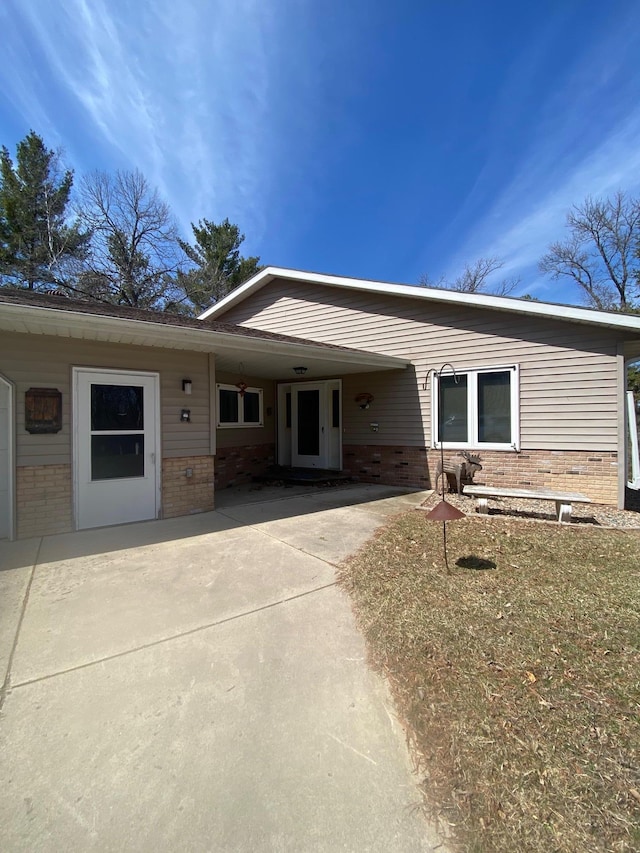 view of front of property featuring brick siding