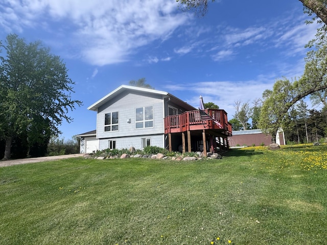 918 Division St, Elbow Lake, MN 56531 - back of house featuring a deck, a yard, driveway, and stairs