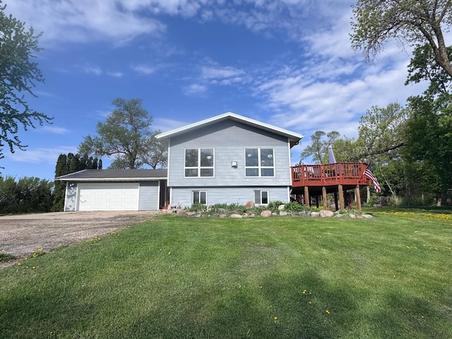 918 Division St, Elbow Lake, MN 56531 - view of front of house featuring asphalt driveway, a front yard, an attached garage, and a wooden deck