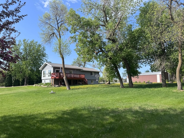 918 Division St, Elbow Lake, MN 56531 - view of green lawn with a wooden deck and stairs
