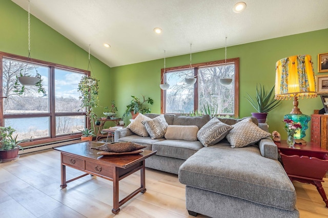 918 Division St, Elbow Lake, MN 56531 - living room with baseboard heating, recessed lighting, lofted ceiling, and light wood finished floors