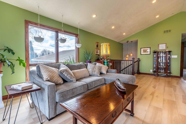 918 Division St, Elbow Lake, MN 56531 - living area with lofted ceiling, recessed lighting, baseboards, and light wood-style floors
