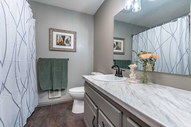 918 Division St, Elbow Lake, MN 56531 - bathroom with toilet, vanity, and a textured ceiling