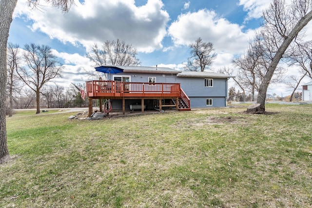 918 Division St, Elbow Lake, MN 56531 - rear view of house with a deck, a yard, stairway, and metal roof