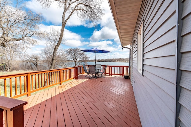 918 Division St, Elbow Lake, MN 56531 - wooden deck with outdoor dining space and a water view