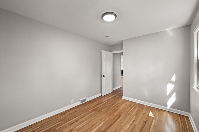 4240 Lake Road Ave, Robbinsdale, MN 55422 - unfurnished bedroom featuring visible vents, baseboards, and light wood finished floors