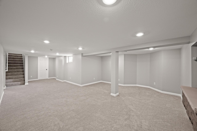4240 Lake Road Ave, Robbinsdale, MN 55422 - finished basement with recessed lighting, stairway, baseboards, and light colored carpet