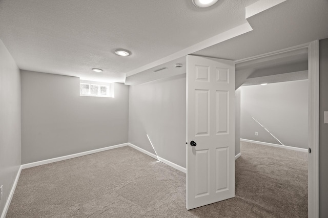 4240 Lake Road Ave, Robbinsdale, MN 55422 - basement featuring baseboards, carpet floors, and a textured ceiling