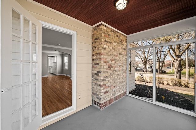 4240 Lake Road Ave, Robbinsdale, MN 55422 - unfurnished sunroom featuring arched walkways
