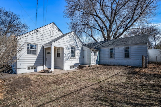 4240 Lake Road Ave, Robbinsdale, MN 55422 - view of front of home with fence, entry steps, and a shingled roof