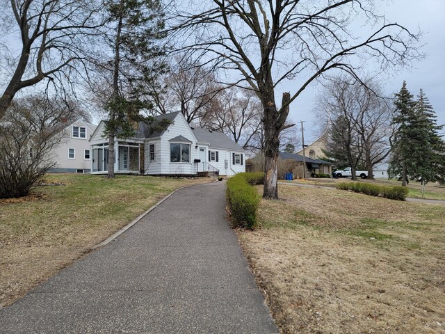 4240 Lake Road Ave, Robbinsdale, MN 55422 - view of front facade featuring aphalt driveway and a front yard