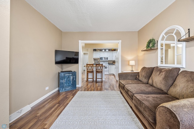 804 8th St N Unit 2, Fargo, ND 58102 - living area featuring wood finished floors and baseboards