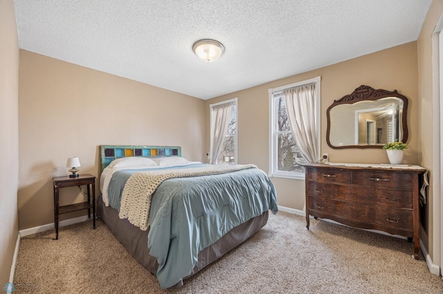 804 8th St N Unit 2, Fargo, ND 58102 - bedroom featuring carpet floors and a textured ceiling