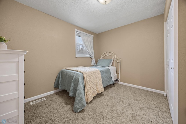 804 8th St N Unit 2, Fargo, ND 58102 - bedroom featuring carpet flooring and a textured ceiling