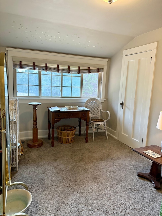 sitting room featuring lofted ceiling, carpet flooring, and baseboards