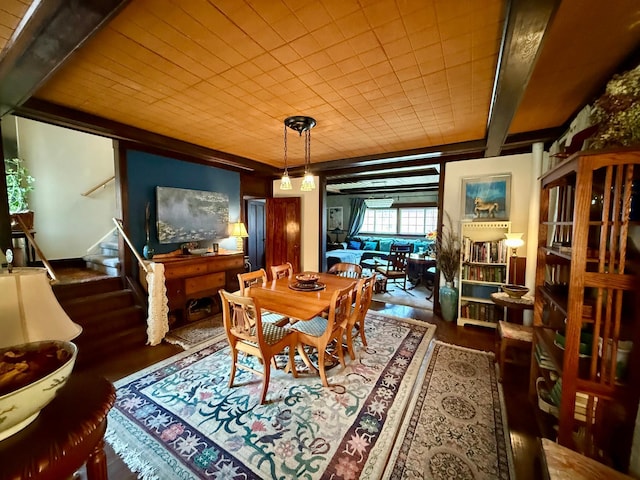 dining space featuring stairway and wood finished floors