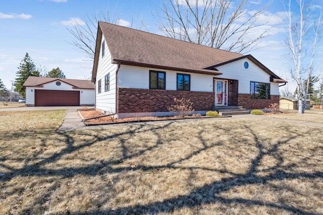 ranch-style home featuring a shingled roof and brick siding