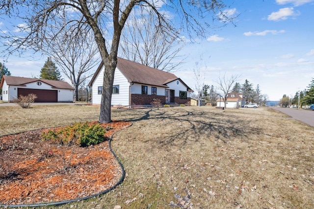 view of front of property with brick siding and an outbuilding