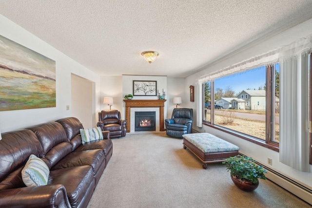 carpeted living area featuring a fireplace with flush hearth, a textured ceiling, and a baseboard radiator