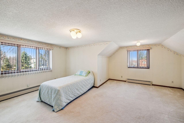 bedroom featuring lofted ceiling, baseboards, carpet flooring, and a baseboard radiator
