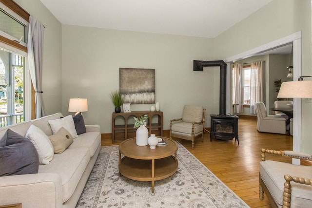 794 Laurel Ave, Saint Paul, MN 55104 - living room with a wood stove, healthy amount of natural light, and wood finished floors