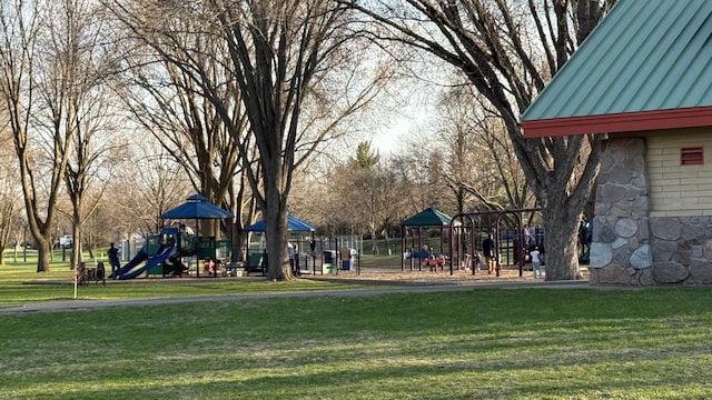 surrounding community featuring a yard and playground community