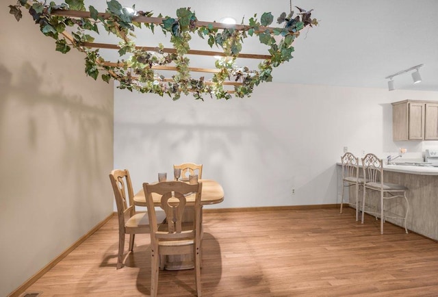 12626 43rd St NE, Saint Michael, MN 55376 - dining room featuring light wood-type flooring and baseboards