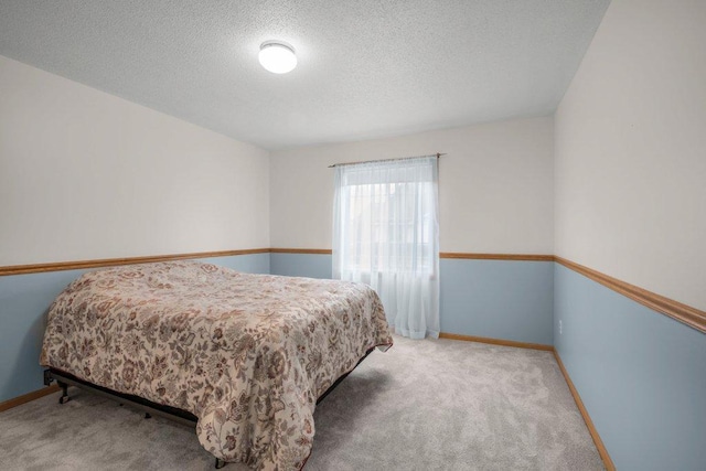 12626 43rd St NE, Saint Michael, MN 55376 - bedroom featuring carpet, a textured ceiling, and baseboards