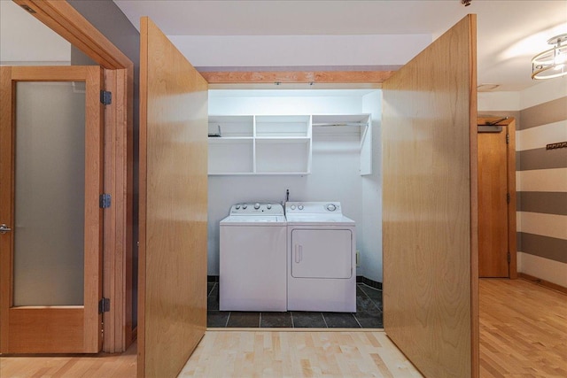 401 2nd St N Unit 220, Minneapolis, MN 55401 - clothes washing area with washing machine and dryer, wood finished floors, and laundry area