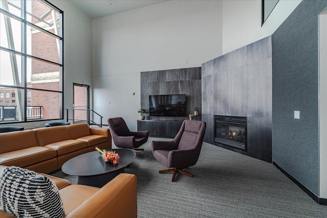 401 2nd St N Unit 220, Minneapolis, MN 55401 - carpeted living area featuring a high ceiling and a tile fireplace