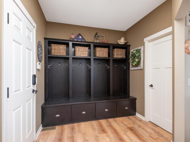 11460 Eagle Creek Ln, Rogers, MN 55374 - mudroom featuring wood finished floors and baseboards