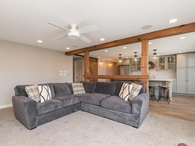 11460 Eagle Creek Ln, Rogers, MN 55374 - living area featuring recessed lighting, a ceiling fan, baseboards, light wood-style floors, and beam ceiling