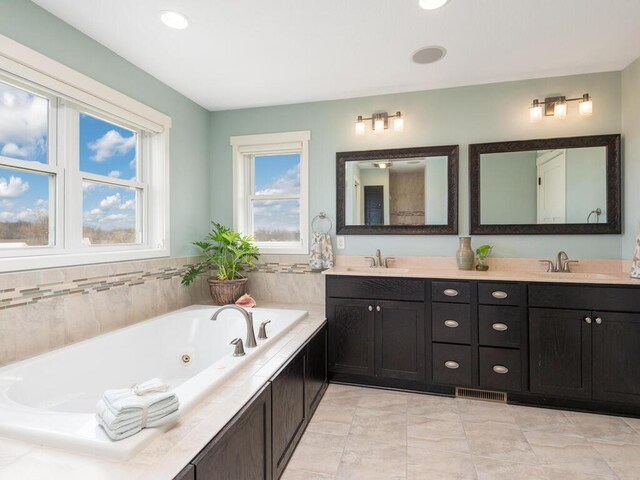 11460 Eagle Creek Ln, Rogers, MN 55374 - bathroom with double vanity, a tub with jets, and tile patterned flooring