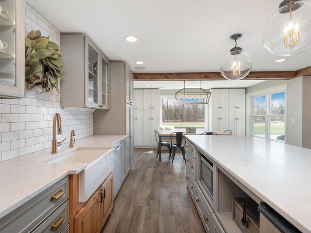 11460 Eagle Creek Ln, Rogers, MN 55374 - kitchen featuring appliances with stainless steel finishes, gray cabinets, dark wood-style flooring, decorative backsplash, and recessed lighting