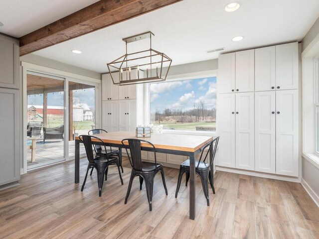 11460 Eagle Creek Ln, Rogers, MN 55374 - dining room featuring light wood-type flooring, recessed lighting, and a chandelier
