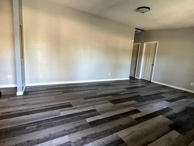 720 2nd St E, Lake Lillian, MN 56253 - empty room with dark wood-style flooring and baseboards