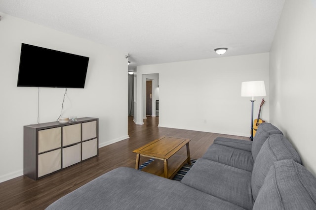 living room featuring baseboards and wood finished floors
