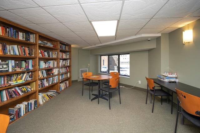 carpeted home office with a paneled ceiling and visible vents