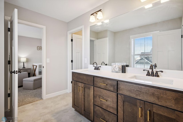 17917 Hayes Ave, Lakeville, MN 55044 - full bathroom with baseboards, a sink, and double vanity