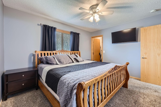 carpeted bedroom featuring a textured ceiling and ceiling fan