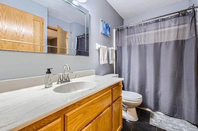 bathroom featuring a textured ceiling, vanity, toilet, and curtained shower